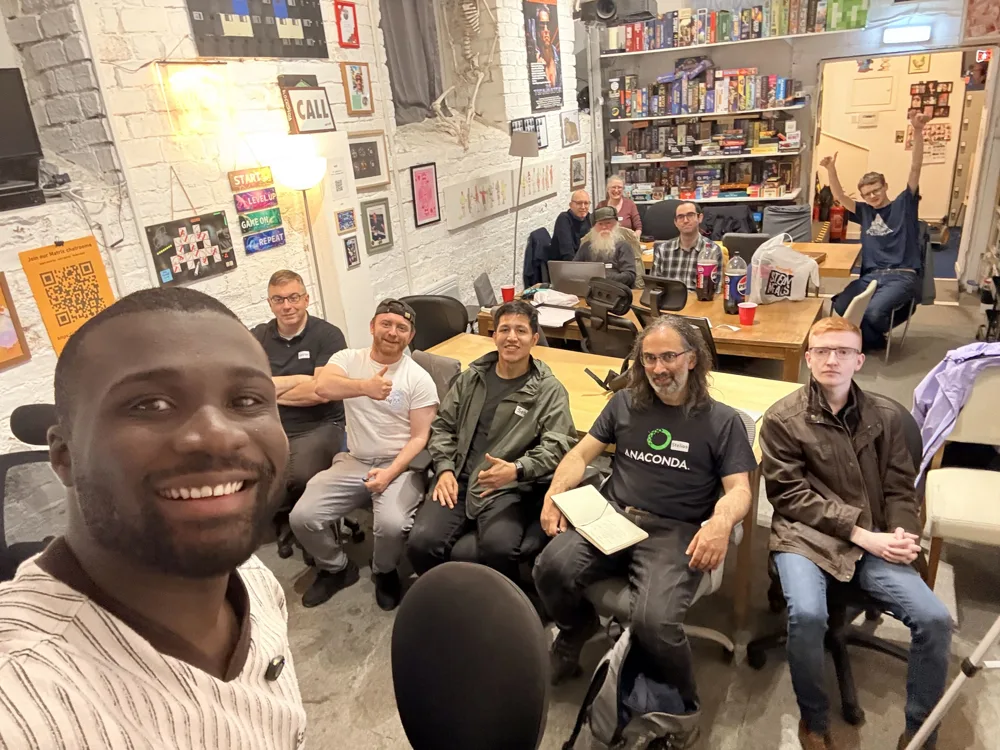 Samuel smiling with a group of people